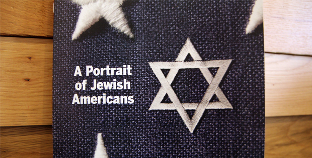 Hard copy of "A Portrait of Jewish Americans," sitting on wooden surface