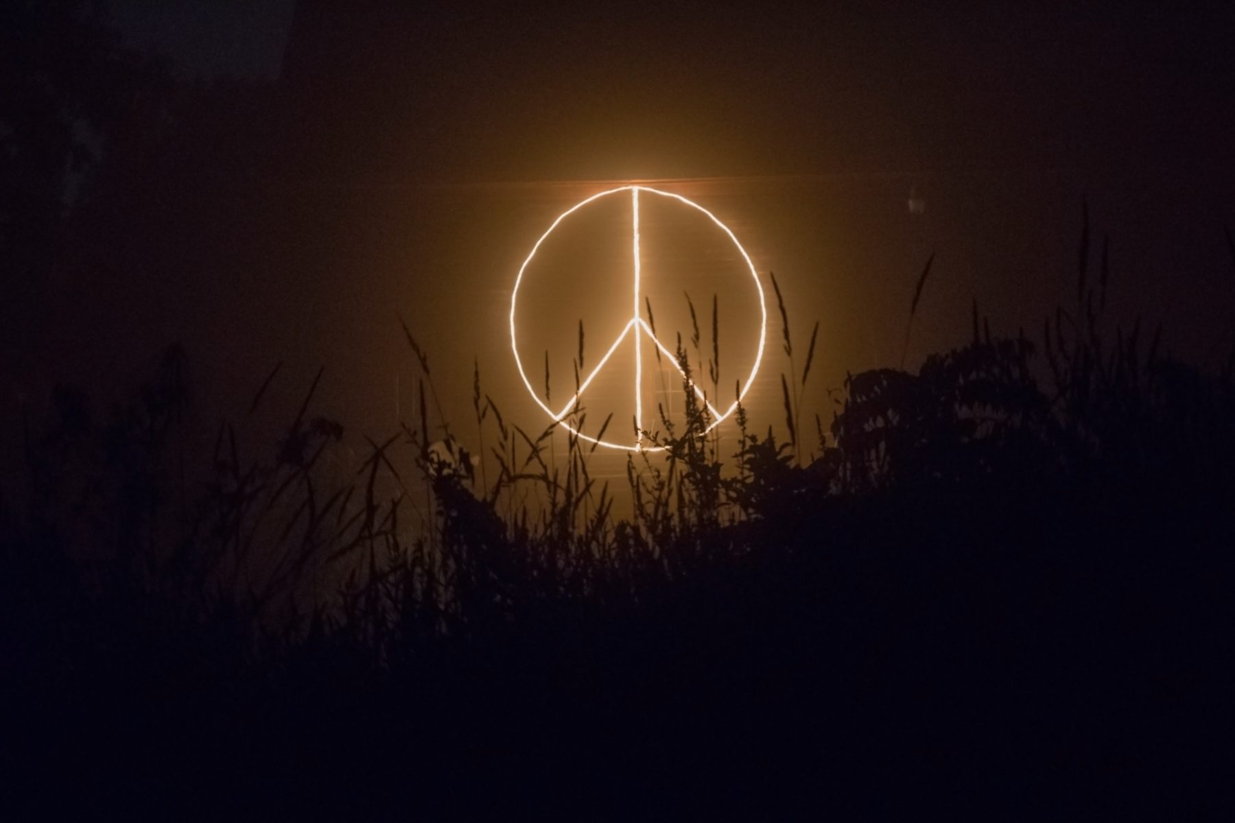 peace symbol of light, in dark setting