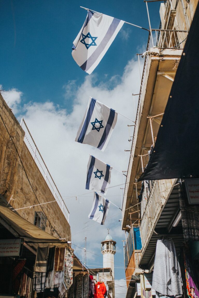 buildings flying Israeli flags