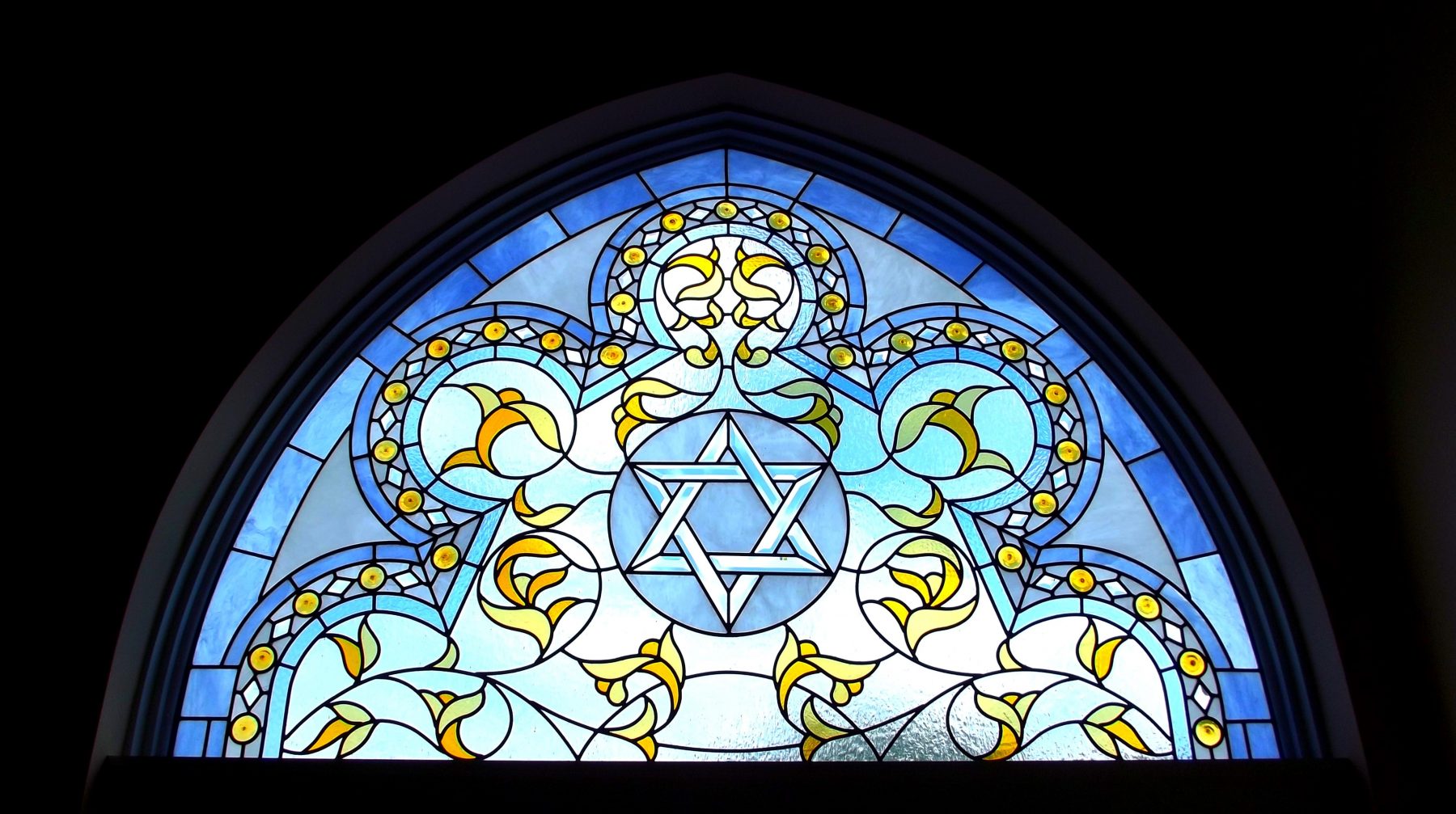 stained glass with Star of David at center