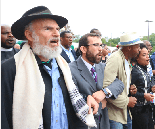 Rabbis Mordechai Liebling and Ari Witkin at a rally