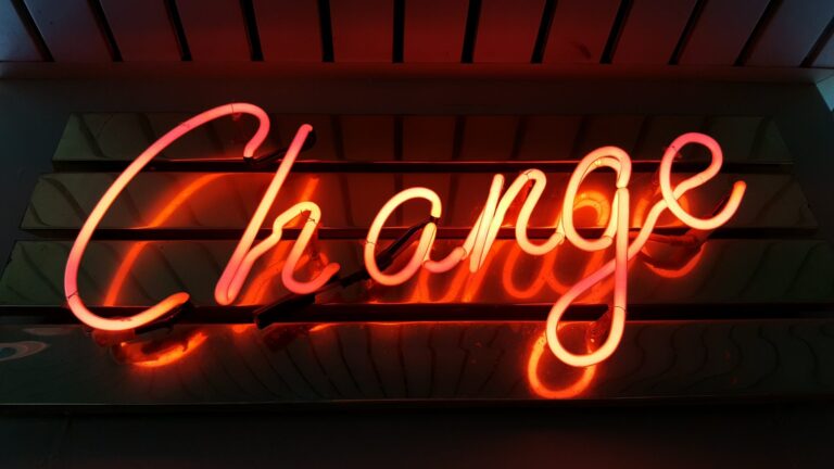neon sign reading "Change"