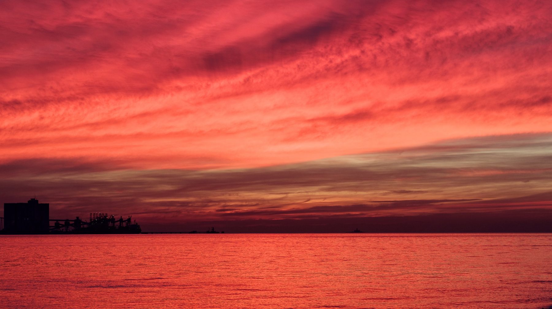 red sky reflected in water