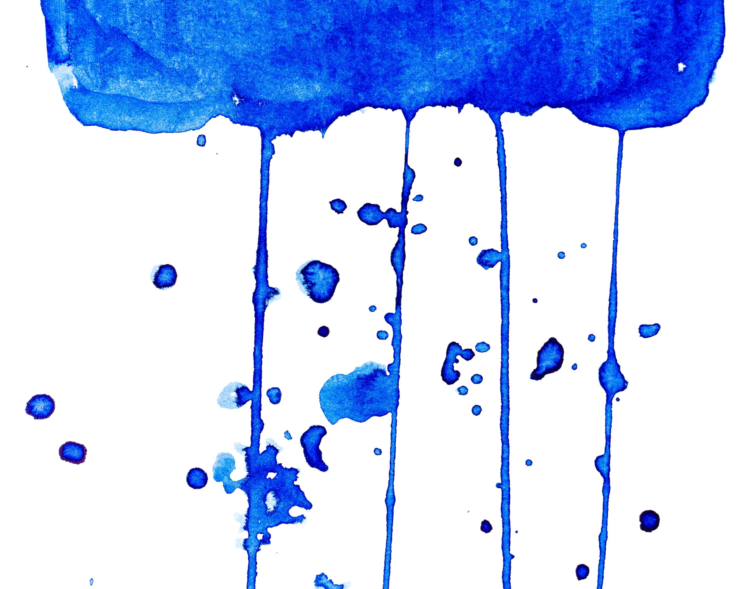 Abstract blue watercolor paint drips and splatters on a white background.