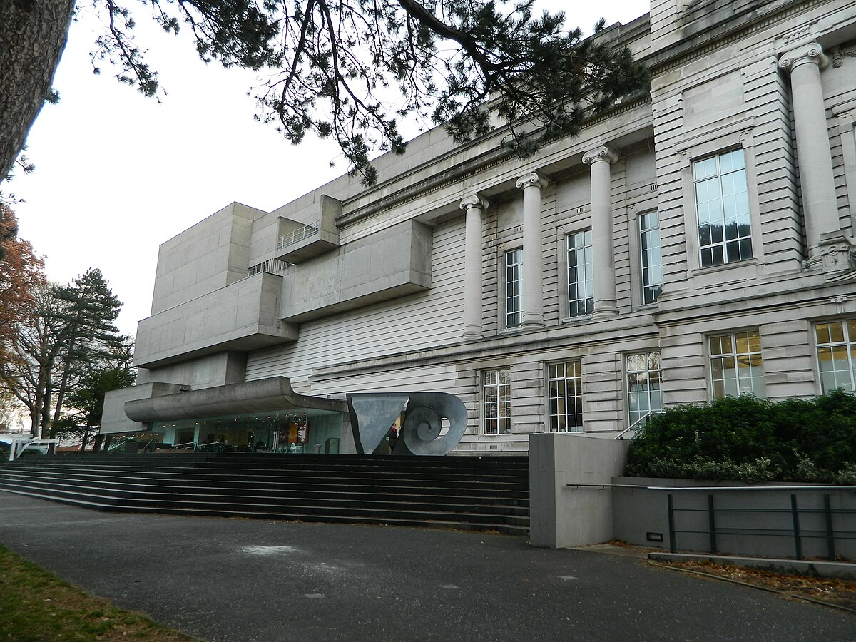 Exterior of a modern art museum with classical columns and contemporary geometric additions.