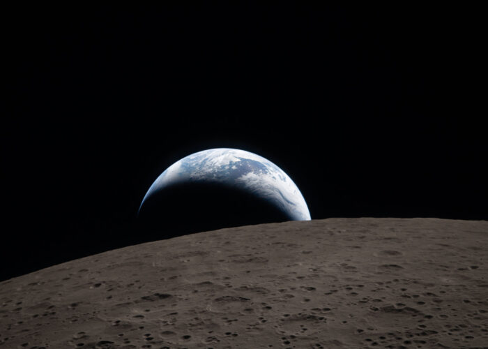 art002e009288 (April 6, 2026) – Earthset captured through the Orion spacecraft window at 6:41 p.m. EDT, April 6, 2026, during the Artemis II crew’s flyby of the Moon. A muted blue Earth with bright white clouds sets behind the cratered lunar surface.
The dark portion of Earth is experiencing nighttime. On Earth’s day side, swirling clouds are visible over the Australia and Oceania region.  
In the foreground, Ohm crater has terraced edges and a flat floor interrupted by central peaks. Central peaks form in complex craters when the lunar surface, liquefied on impact, splashes upwards during the crater’s formation.
