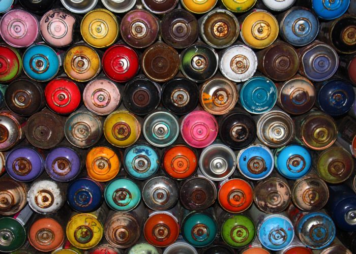 many colorful spraypaint cans from above