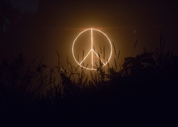 peace symbol of light, in dark setting