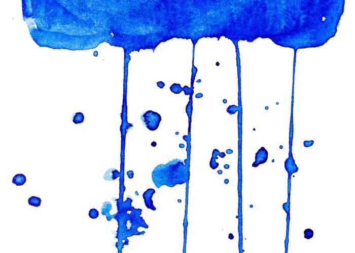 Abstract blue watercolor paint drips and splatters on a white background.