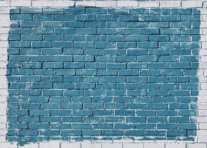 Blue brick wall with a white border.