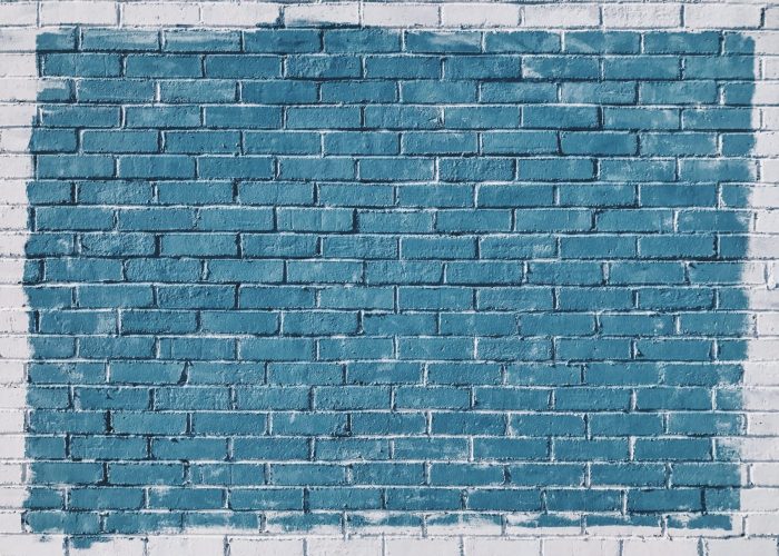 painted brick wall - large light blue rectangle surrounded in white