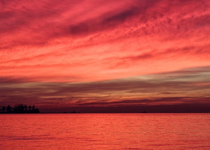 red sky reflected in water