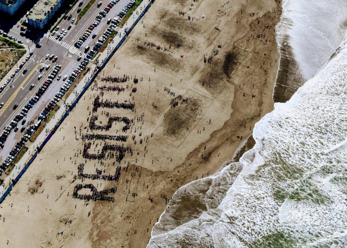 aerial view of protestors forming the message RESIST!!